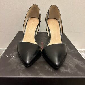 Maiden Lane black heels with cutout ankle.